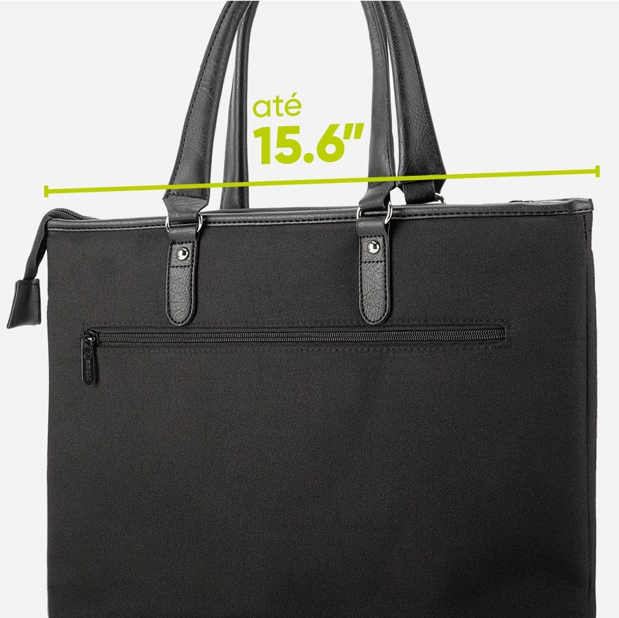 Mouse ergonômico ao lado de um notebook.